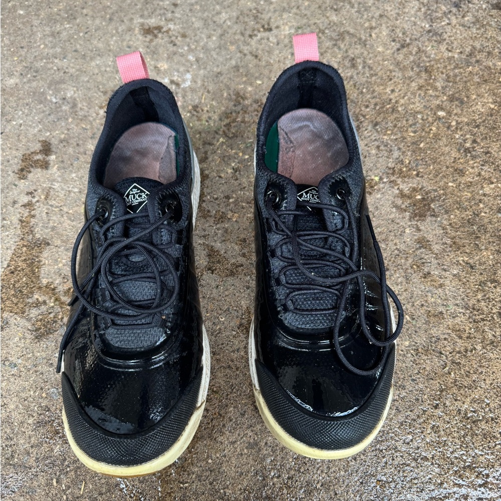 Black and pink Muck Boot shoes